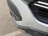 a close up of the front of a car with the hood up