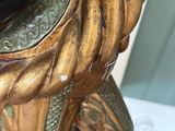 a statue of an elephant with a hat on it ' s head