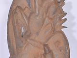 a wooden sculpture of a bird sitting on a chair