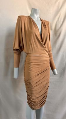 a mannequin dress with long sleeves and a v neckline