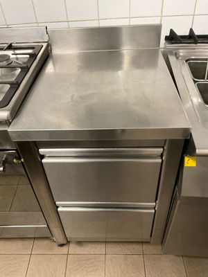 a stainless steel counter top in a commercial kitchen
