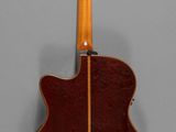 a close up of a guitar on a gray background