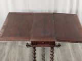 an old wooden table with two legs and a wooden table top