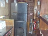 an image of a kitchen with a refrigerator and a stove