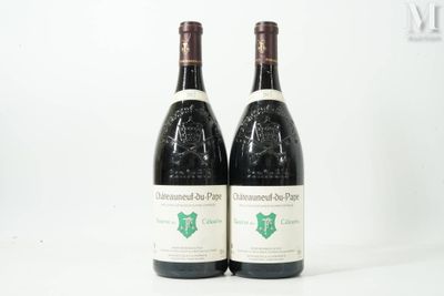 two bottles of wine sitting next to each other on a white surface