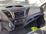 a dashboard of a car with a radio and a steering wheel