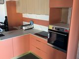 a kitchen with a stove, oven, sink and cabinets in it