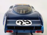a toy car that is sitting on a white surface