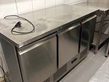 a stainless steel counter top in a commercial kitchen