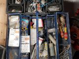 a blue tool box filled with assorted tools on a table