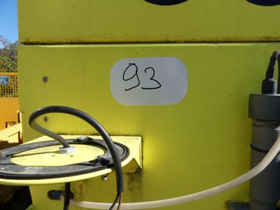 a close up of a yellow machine with a number 23 on it