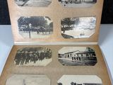 an old photo of an open book with pictures of buildings and people