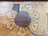 a picture of a painting on the side of a wooden table