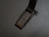 a belt that is attached to a watch on a table