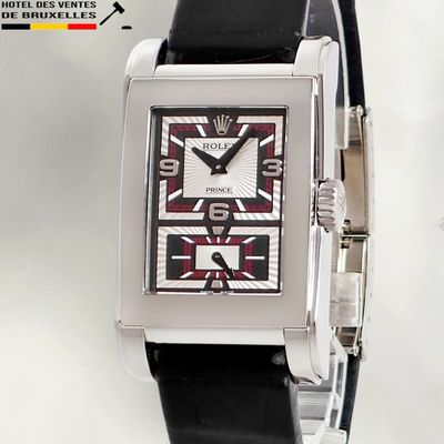 a picture of a black and white watch with a red face