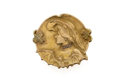 une image représentant une pièce d'or sur laquelle figure une femme coiffée d'un chapeau