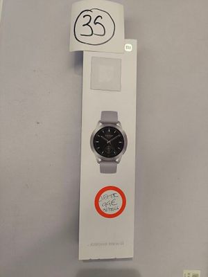 a box with a watch on it that has a sticker on it