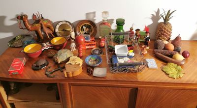 a wooden table with a lot of items on top of it
