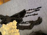 a close up of a piece of clothing on a bed