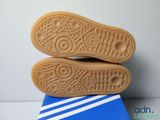 a pair of shoes that are on top of a blue box