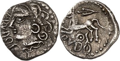 a silver coin with an image of a man on it