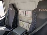 two seats in the back of a van with the back seats folded down