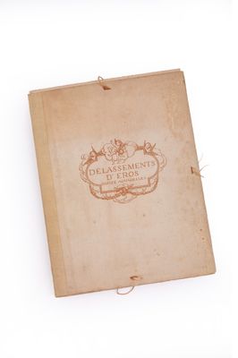 an old book with a picture on it on a white surface