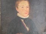 portrait of a young man in a black coat and white collared shirt