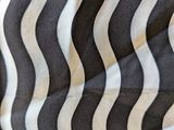 a close up picture of a black and white striped fabric