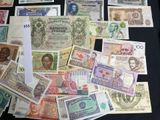 many different types of paper money on the table