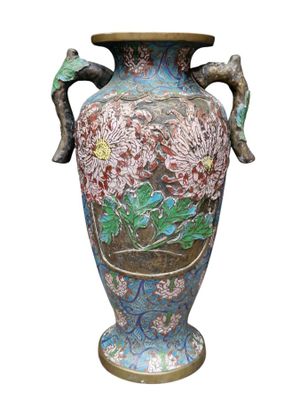 a large vase with flowers painted on it on a white background