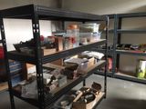 many shelves with various items on them in a room