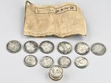a bag full of silver coins sitting on top of a table