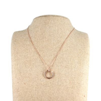 a necklace with a circle pendant on a mannequin mannequin