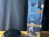 a box with a corded vacuum on a wooden table