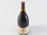a bottle of wine that is sitting on a table
