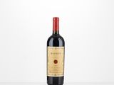 a bottle of red wine sitting on top of a white table