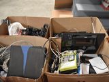 two boxes with electronics in them sitting on the floor