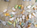 a pile of plastic toys sitting on a wooden floor
