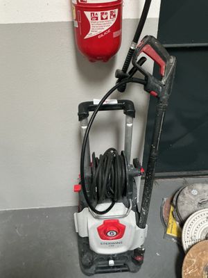 a red and white fire extinguisher next to a black and white fire hydrant