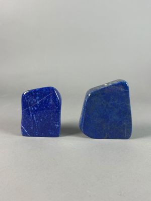 a pair of blue stone stud earrings on a white background