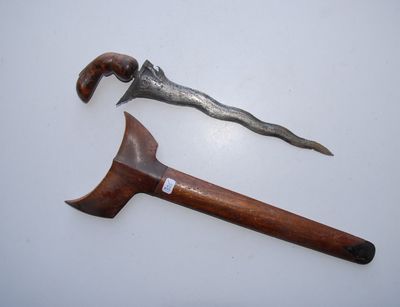a wooden handle and a metal handle on a white surface