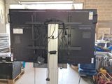 a picture of a large television set in a warehouse