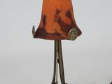 a lamp that is sitting on a table with a cord