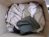 a box full of clothes that is sitting on the floor
