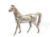 a silver statue of a horse on a white background
