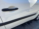 a close up of a car door handle on the side of the car