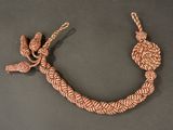 braided bracelet with a knot on a black surface