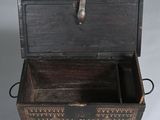 an old wooden box with a metal handle on it