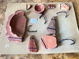 several pieces of clay are sitting on a piece of paper